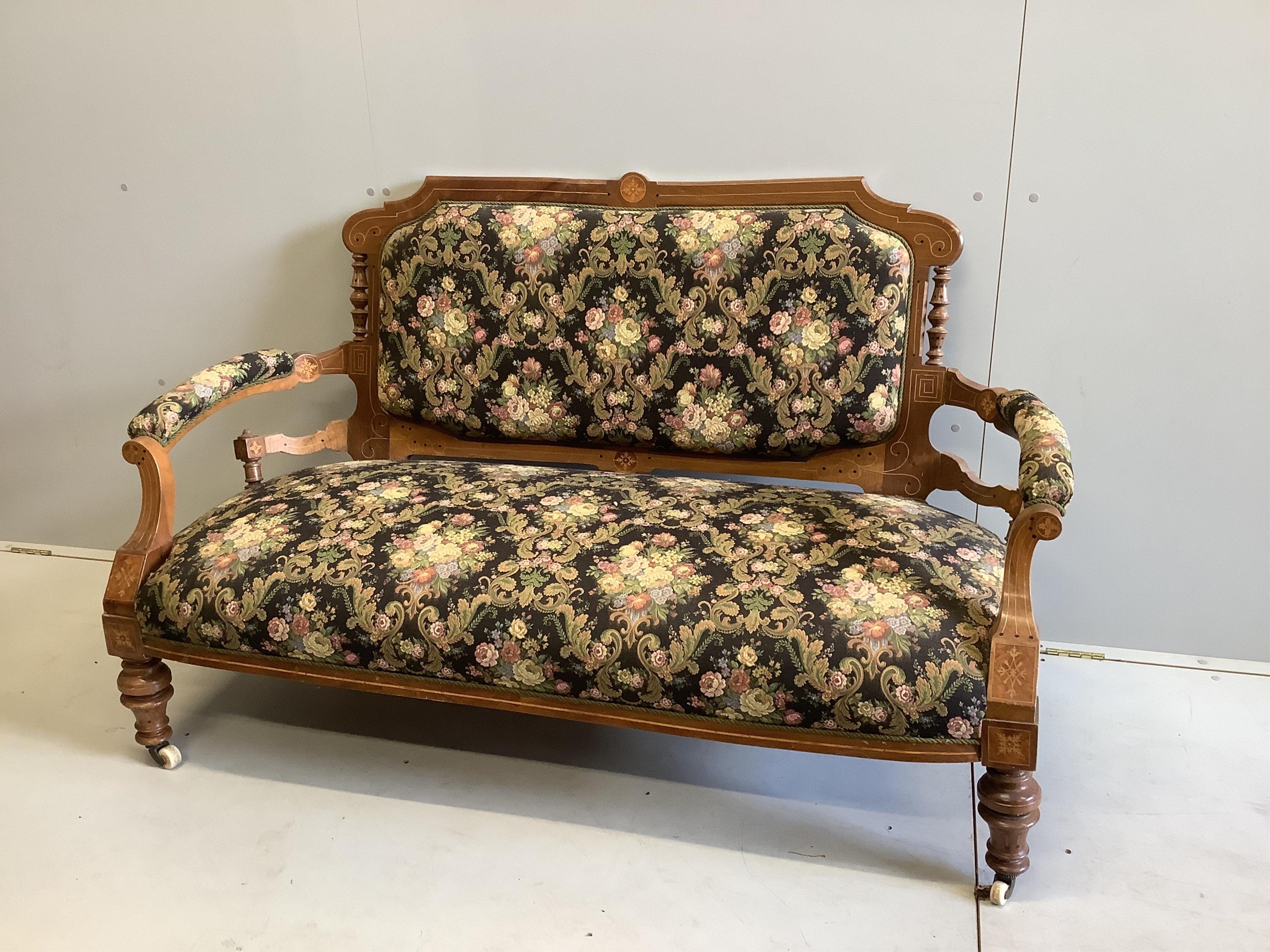 A late Victorian inlaid walnut settee, width 154cm, depth 64cm, height 92cm together with three matching side chairs. Condition - fair